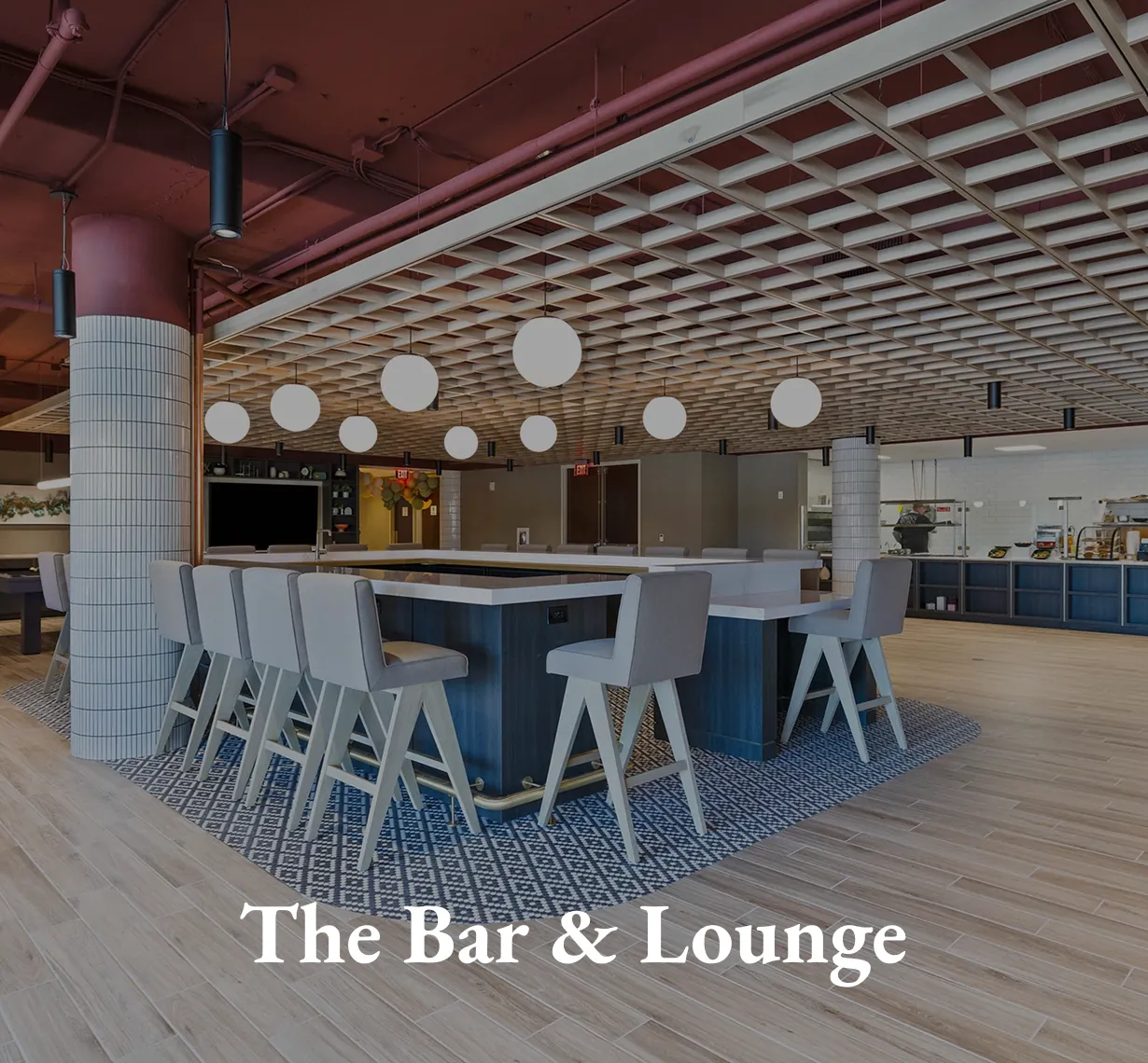The Bar and Lounge, with a long blue bar and high stools