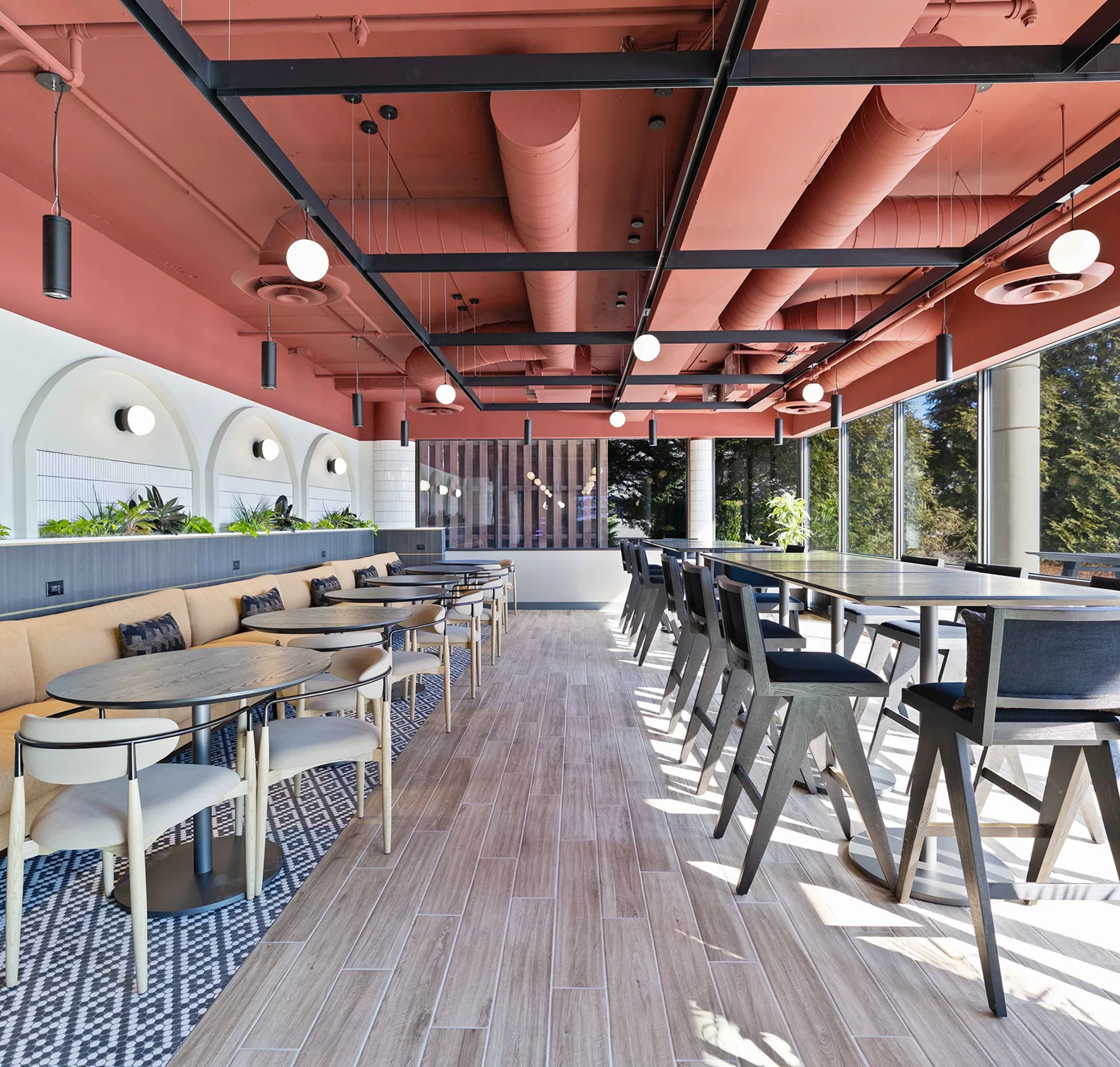 The private dining room, with tables set along a wall of windows