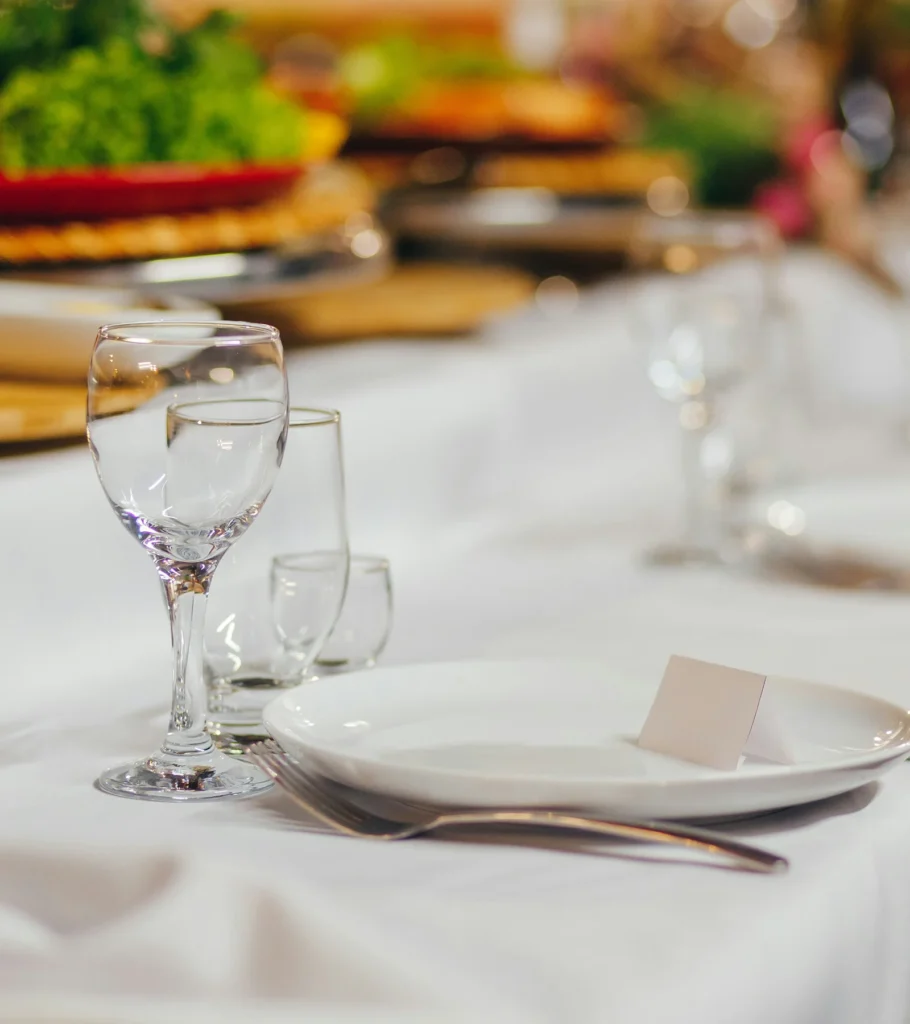 A table set with glassware for an evening event
