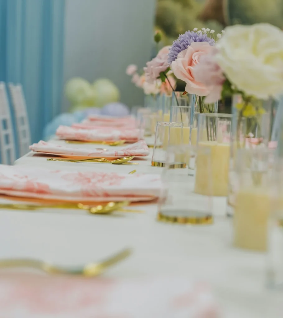 A pastel table setting with flowers for a birthday