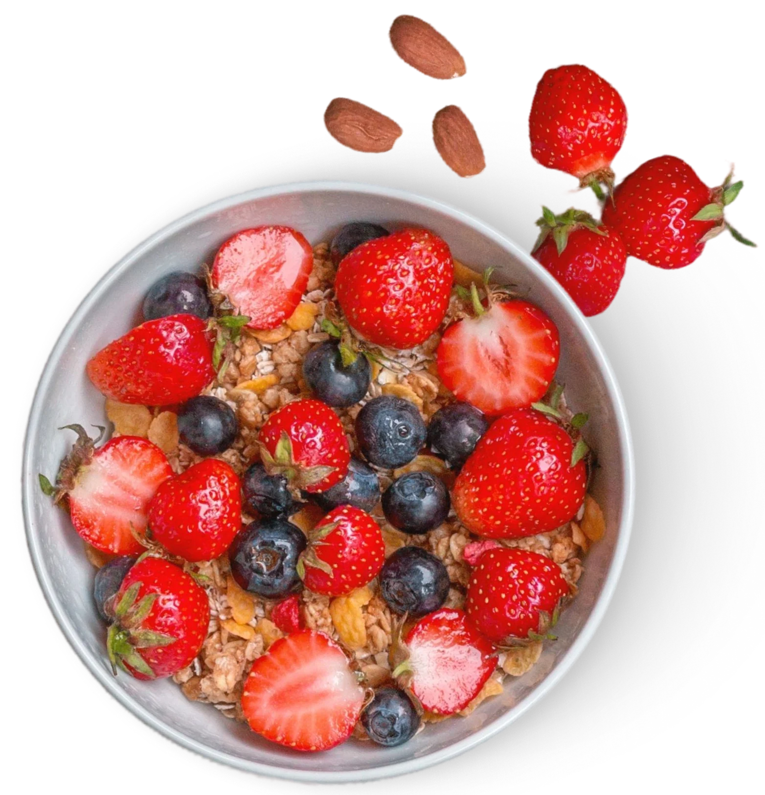A bowl of granola with strawberries and blueberries