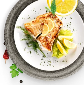 A plated fish dish with lemon